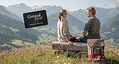 Couple on a wooden bench with a view of the Saanenland