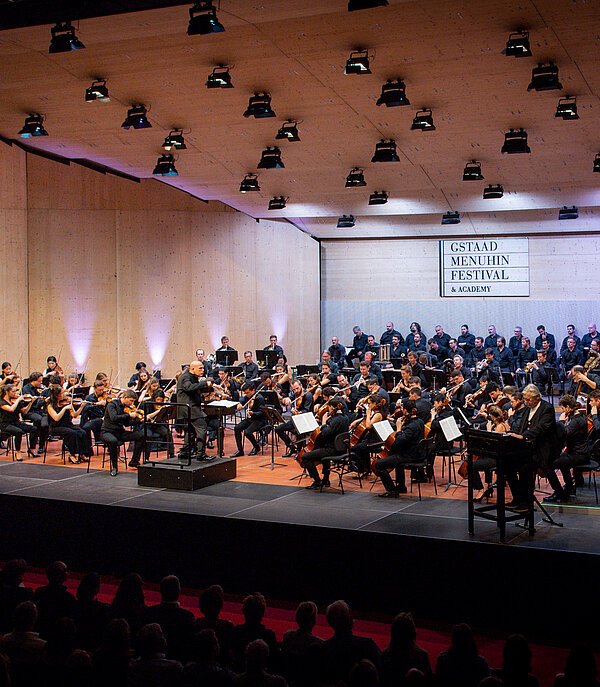 An orchestra playing at the Menuhin Festival Gstaad in Gstaad.